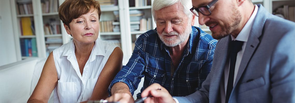Old couples preparing estate plan with help of attorney