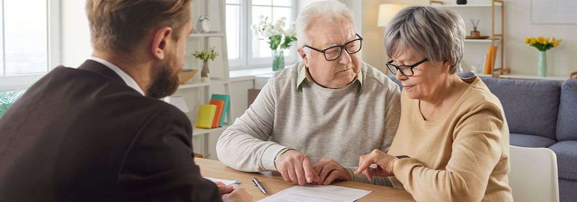 Senior couples reviewing estate plan prepared by professional