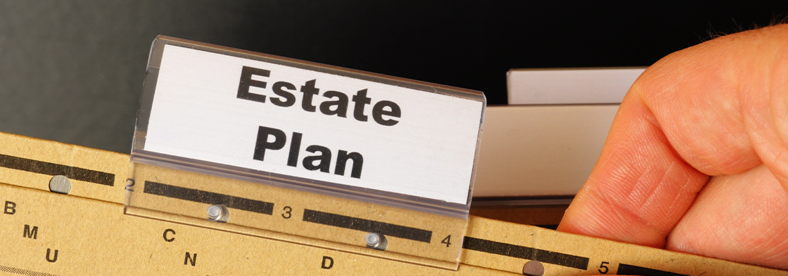 Real estate plan card on scale