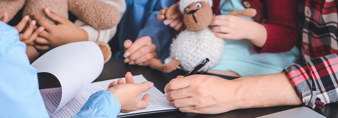 Social worker meeting with couple for signing adoption documents