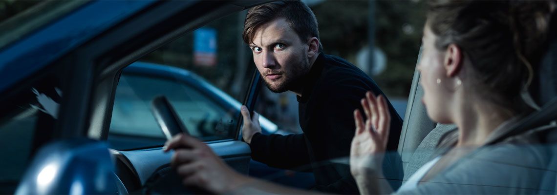Aggressive robber and helpless victim in parking lot