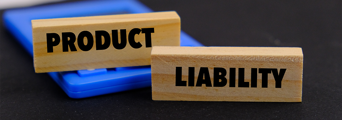 Product liability message written on wooden blocks with black background