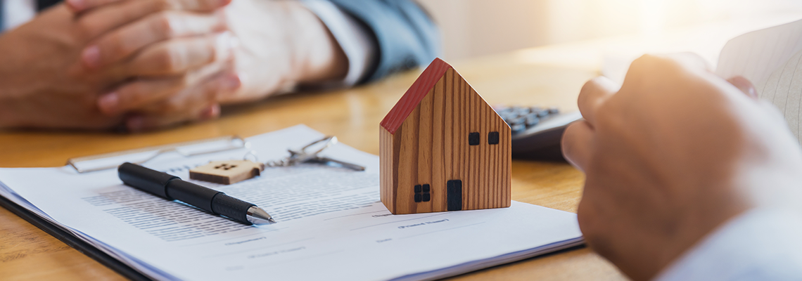 Home buyers meet and negotiate with real estate agents.