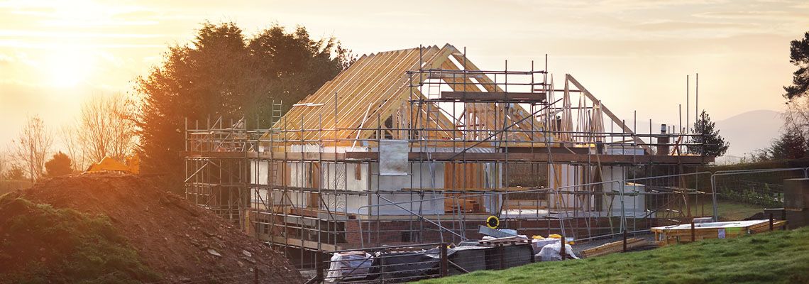 Building site with house under construction