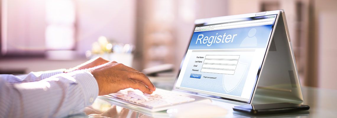 Professional man filling out an online registration form