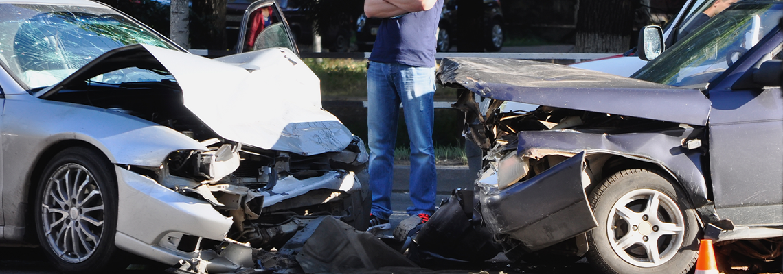 Car Accident with person standing next to the cars