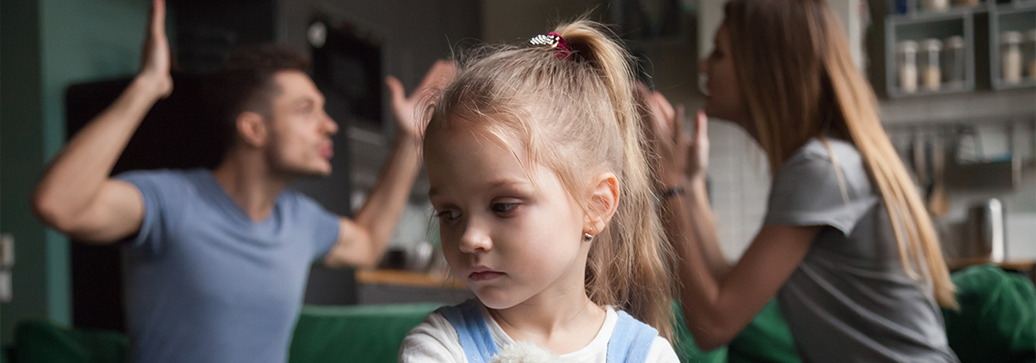 Daughter feels upset while parents fighting at background