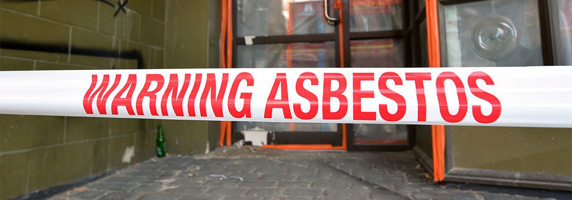 Sign reads, Warning Asbestos
