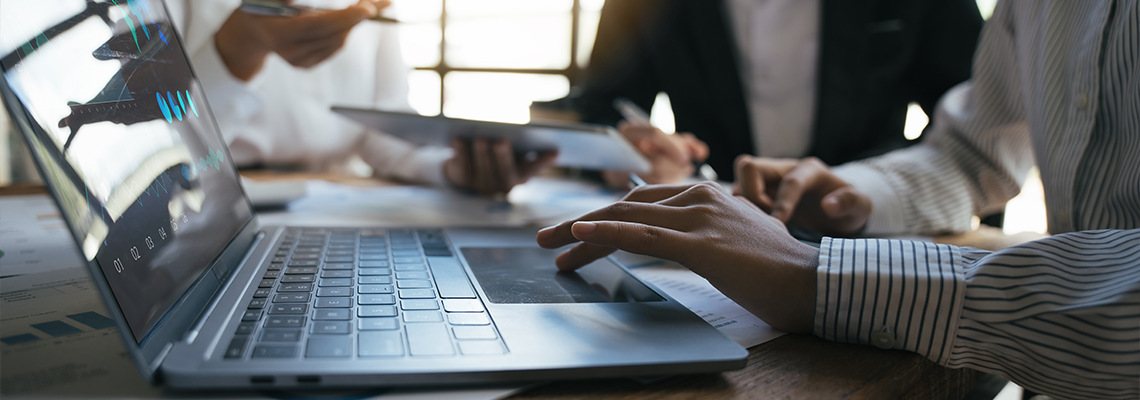 Team of business investment consultant analyzing company annual financial report