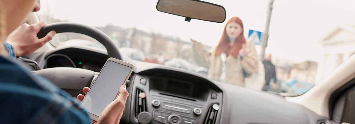 Reckless driver on phone about to hit a pedestrian