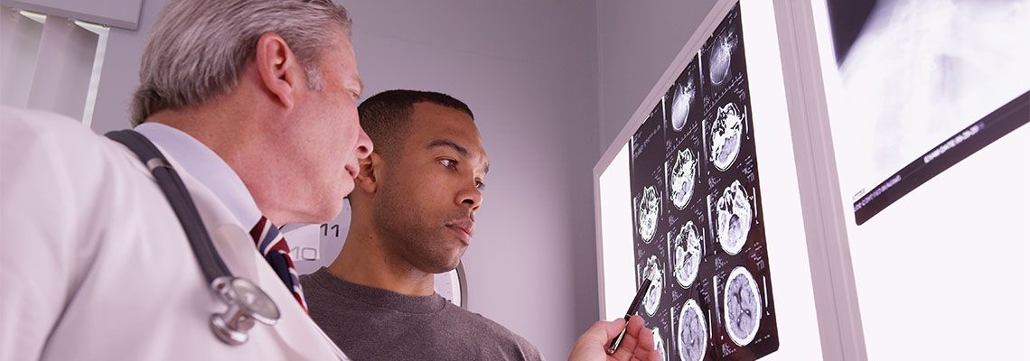 Doctor reviewing Brain MRI of patient