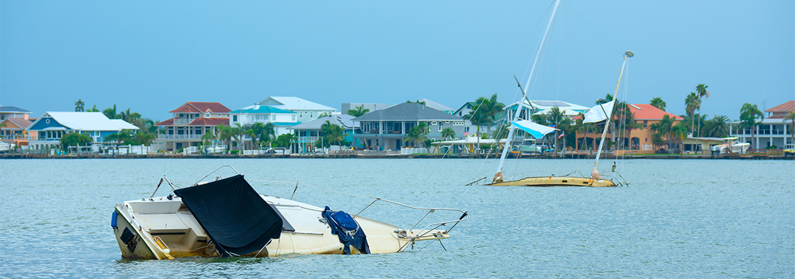 Unsightly nuisance abandoned sunken wrecked sailboats in an intracoastal waterway