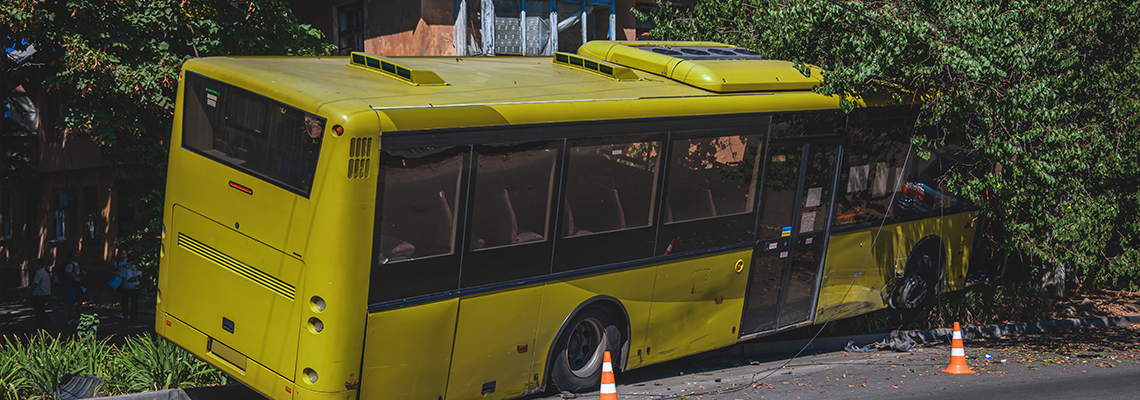The bus flew off the road and crashed into a tree