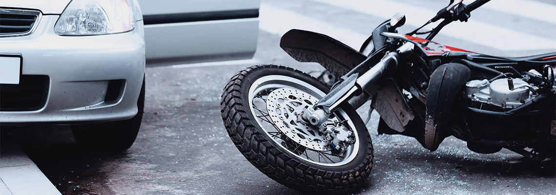 Motorcycle and car accident on the road