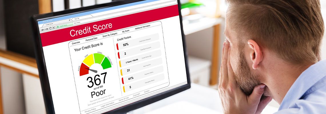 Man looking at his credit score in computer screen