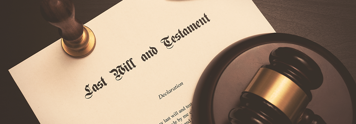 Last Will and Testament document paper and pen