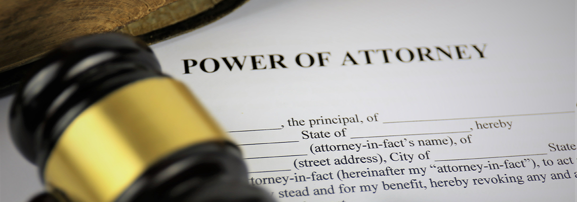 An Image of a attorney of power with gavel document and pen