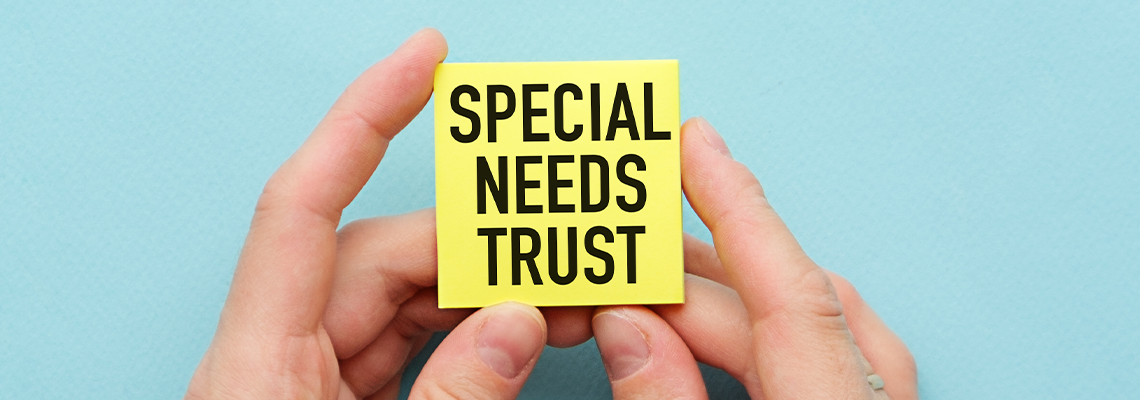 Businessman holding a card with SPECIAL NEEDS PLAN message
