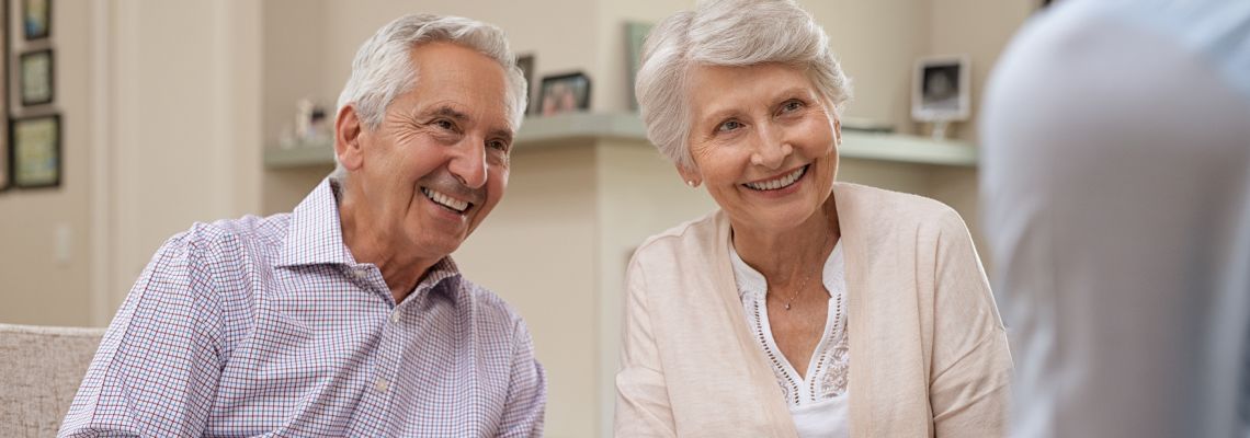 Old couples consulting with attorney