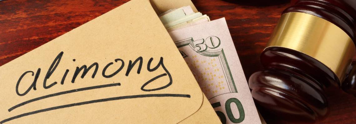 Money inside envelope labelled Alimony and gavel