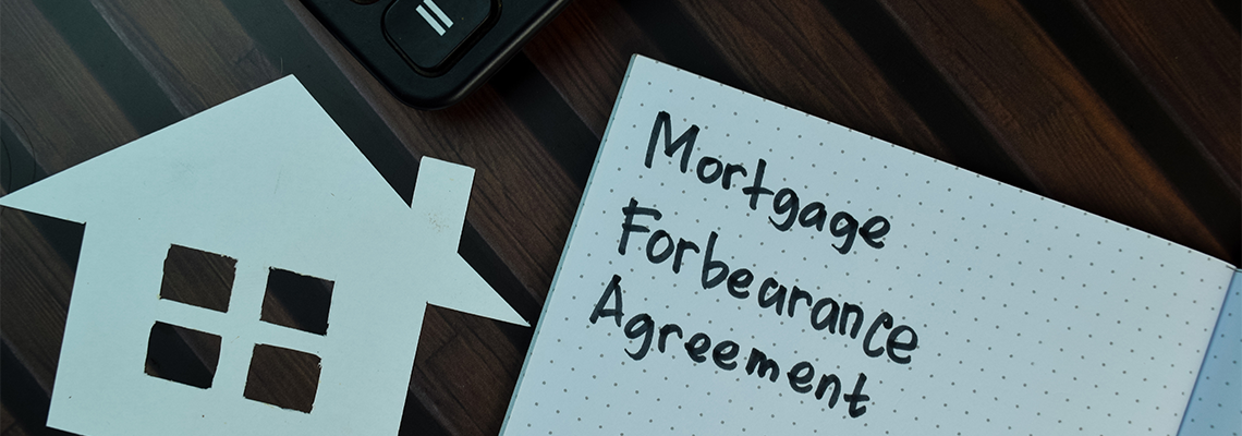 Mortgage Forbearance Agreement Written on A Book