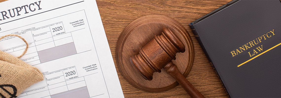 law book and gavel on wooden background