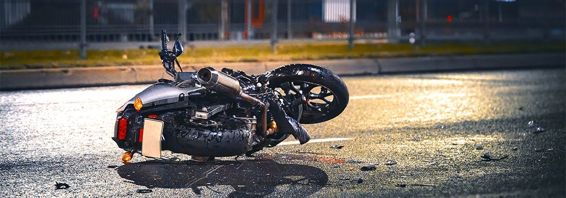 Crashed Motorcycle on road after accident