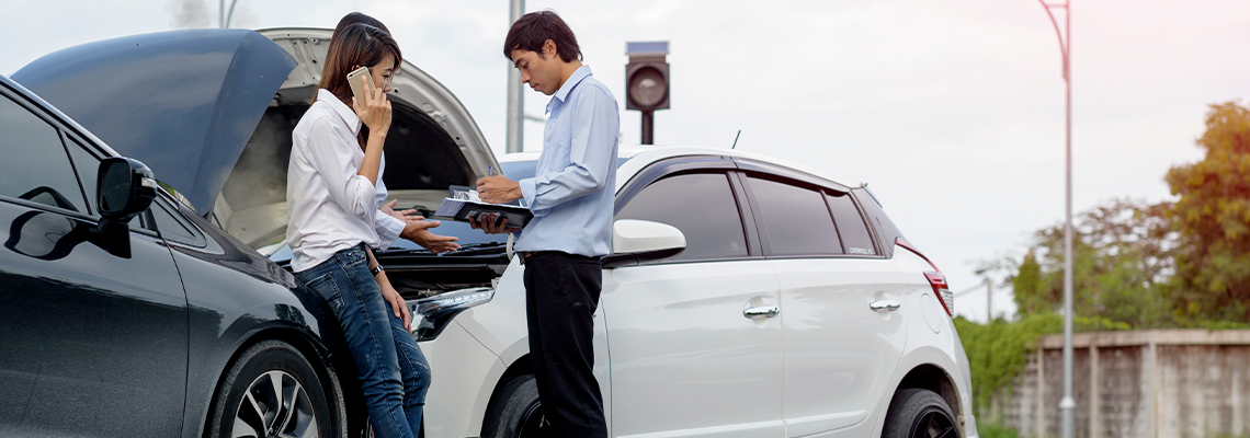 Woman driver calls for instruction during insurance agent review
