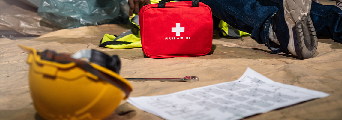 Emergency staff in safety suit use first aid kit to help a man who has an accident
