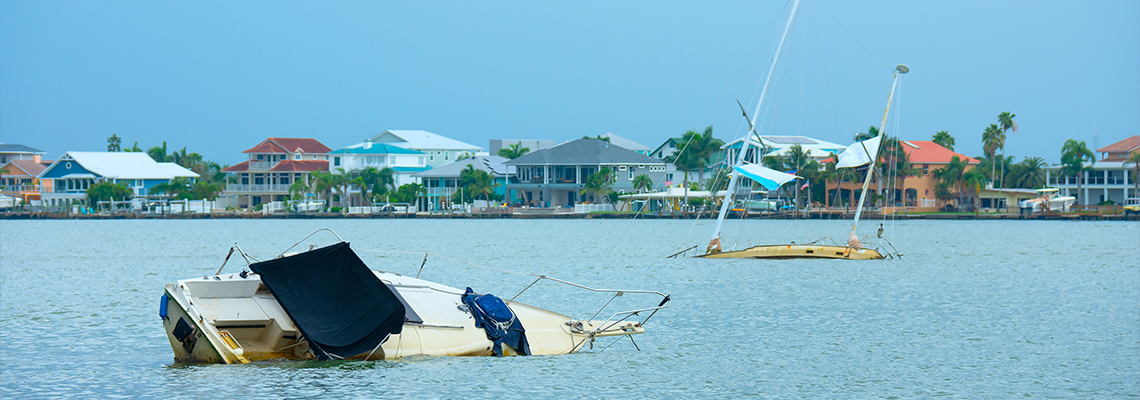 Sunken wrecked sailboats in an intracoastal waterway
