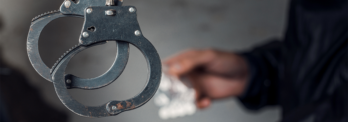 Police officer and man arrested for drug possession