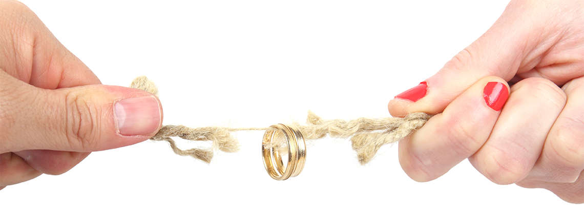 Couple Pulling a thread where ring is hanging