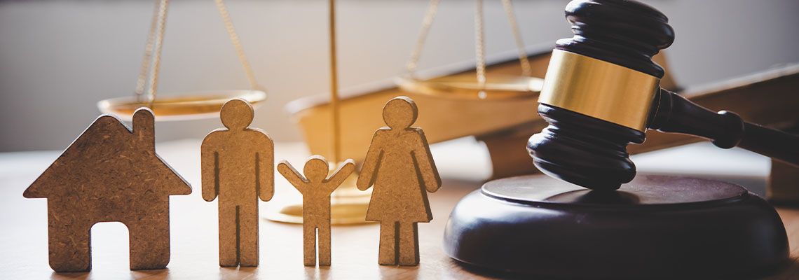 Model house, Paper Family cut out with gavel on table