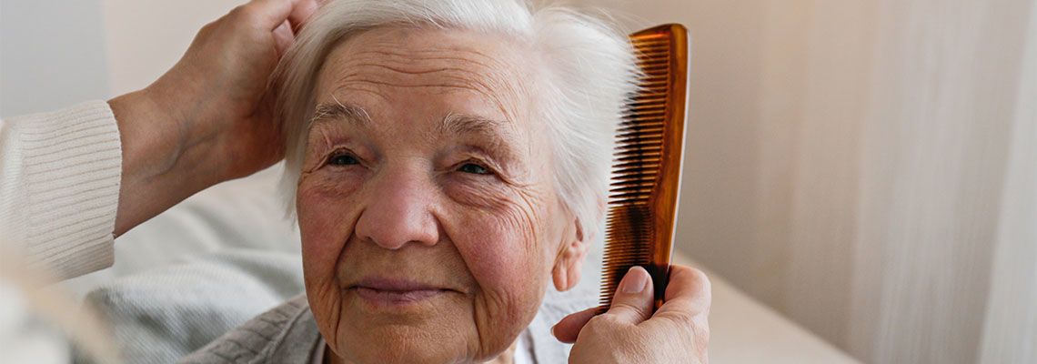 Guardian taking care of old women