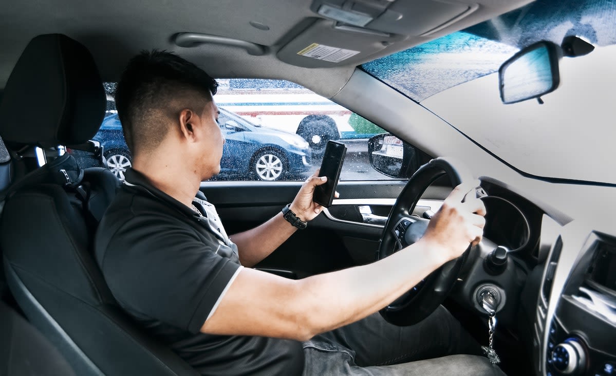 Man texting and driving