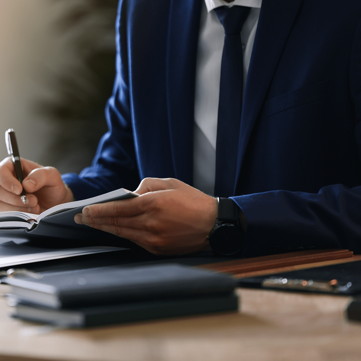 Male lawyer working at table in office, closeup