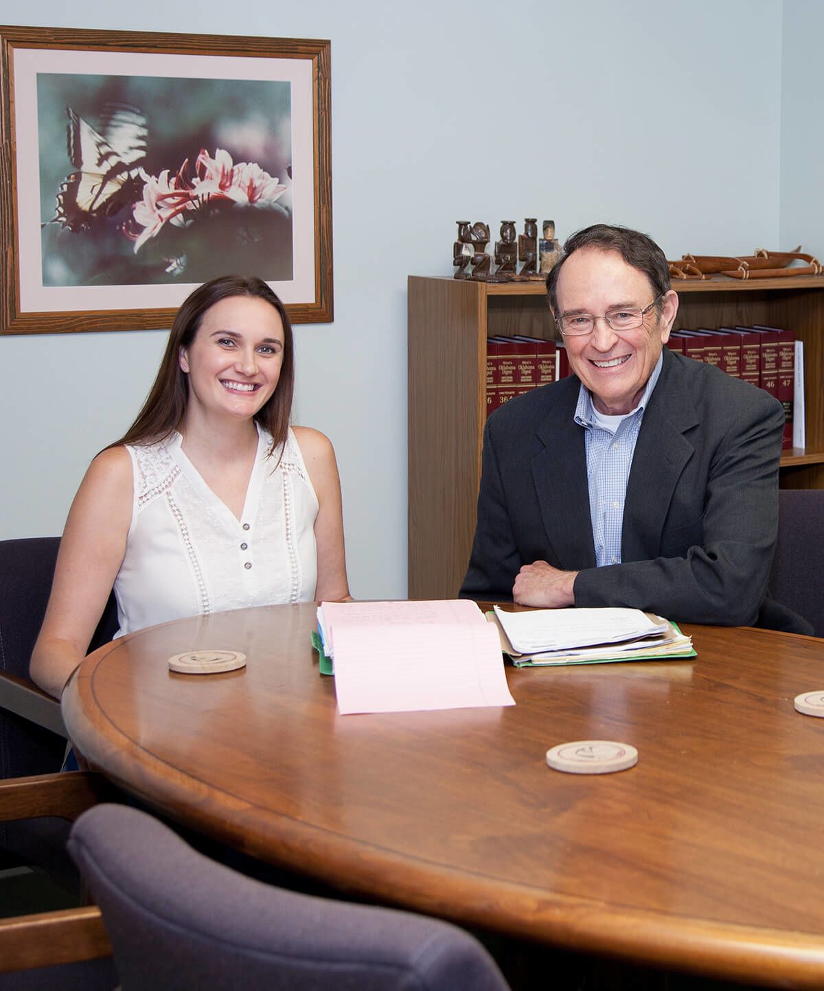 Perez and Stuart consulting at a table