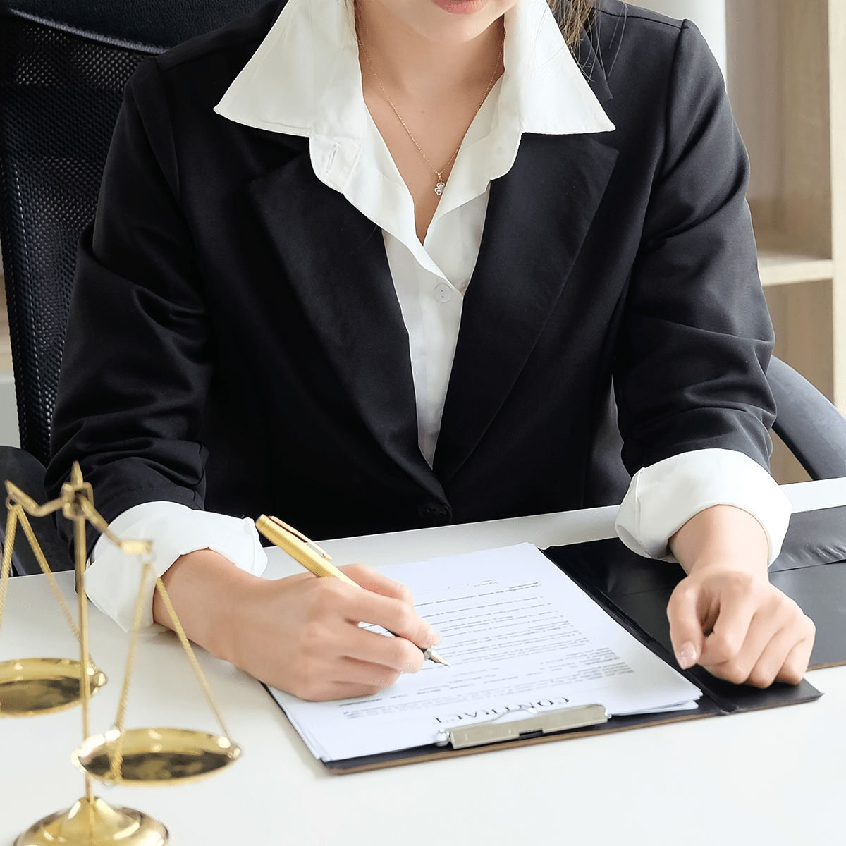 Asian young woman lawyer who is currently working on financial information reading a contract on paper document in private office.