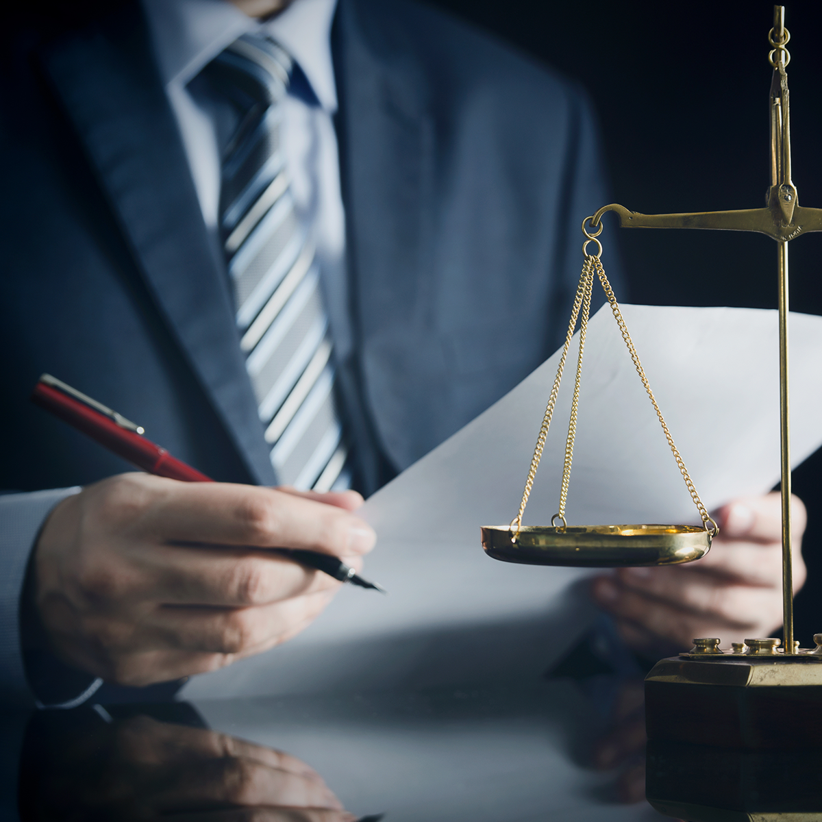 Attorney in a suit with a justice scale