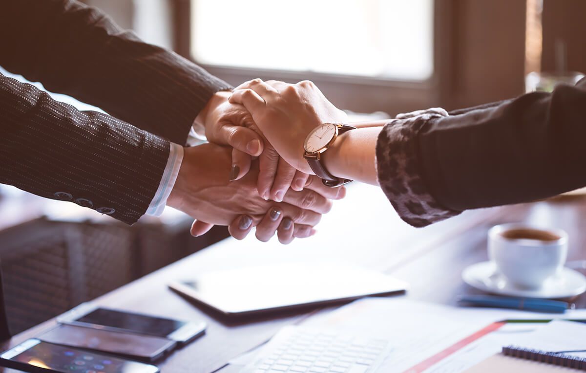 A business man shaking hands with a client