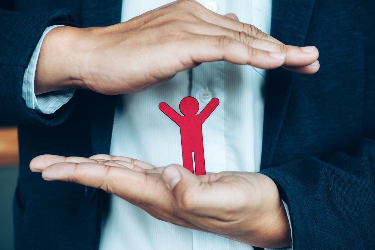 Man Holding a Stick Figure
