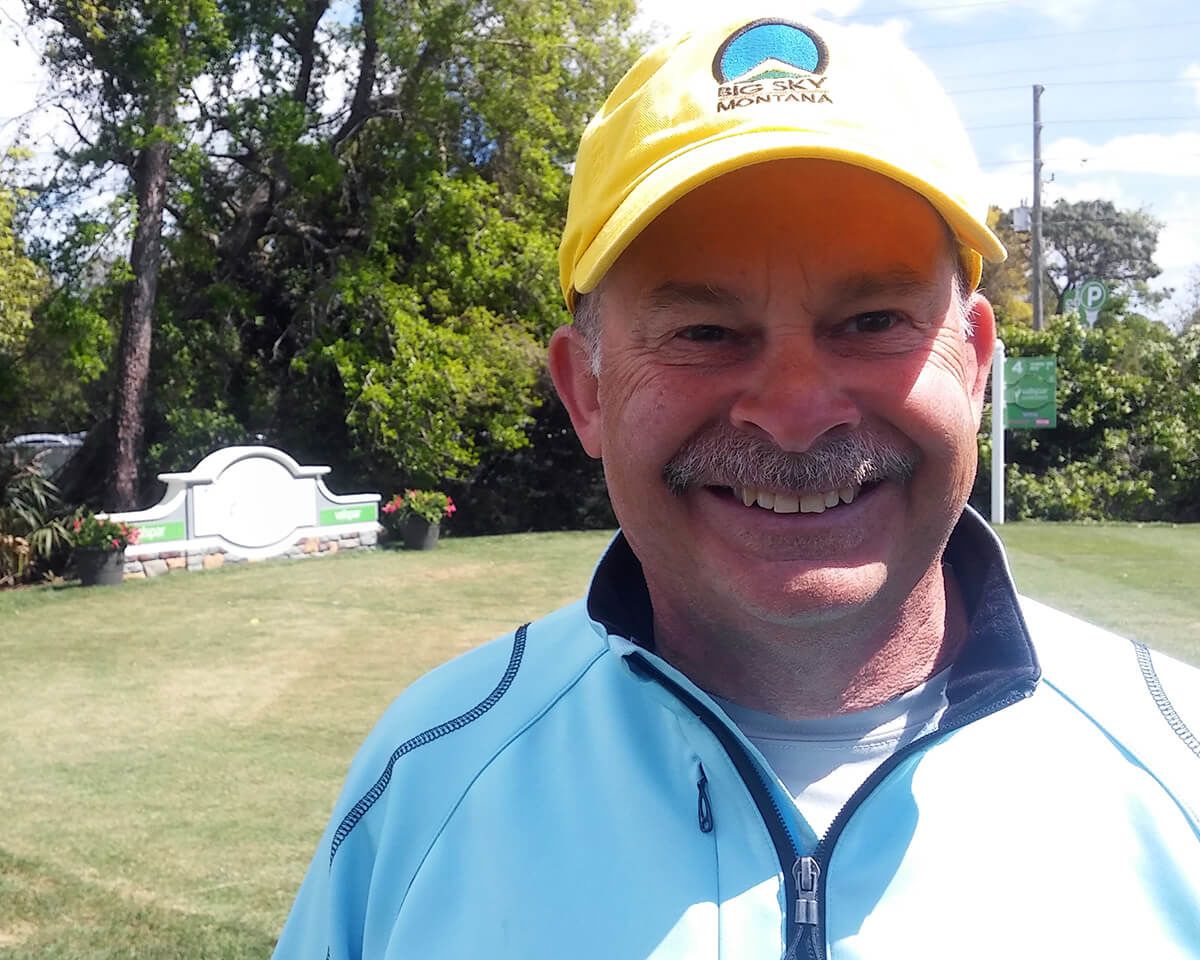 Scott smiling on the golf course