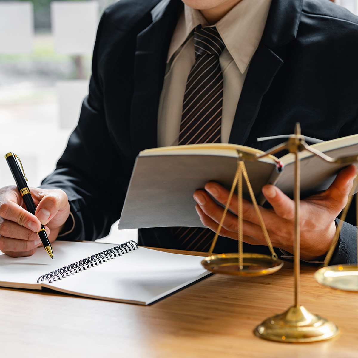 male judge with writing documents on the table