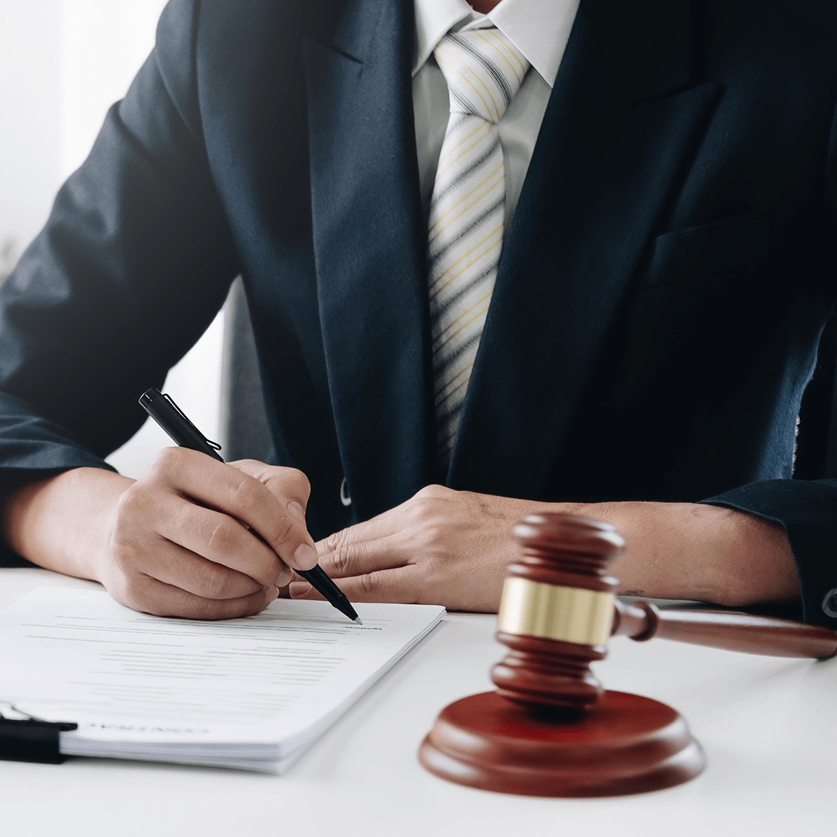 Man signing in document