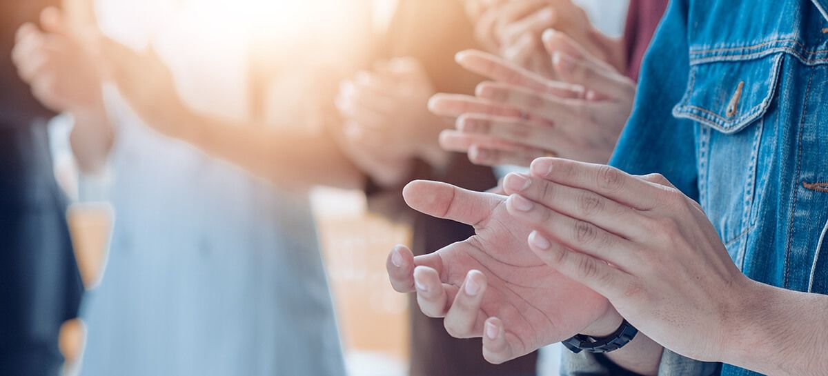 Group of people clapping
