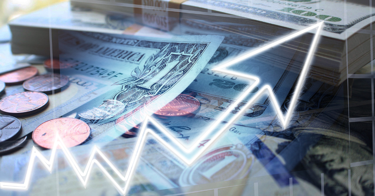 An arrow pointing upwards on top of money piles