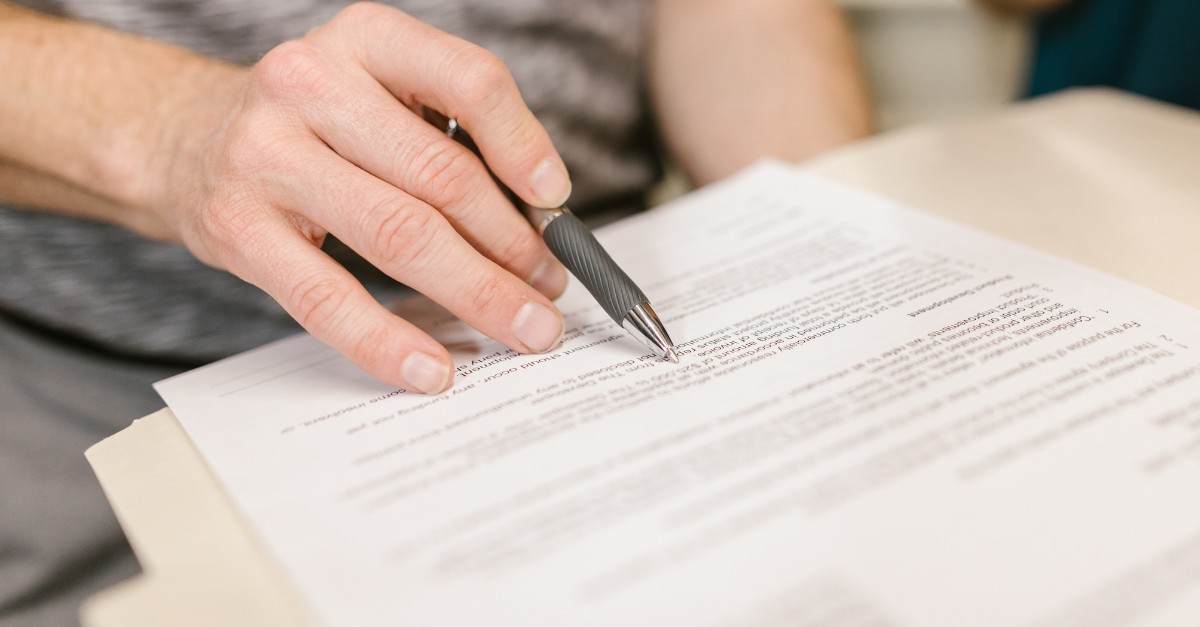 a person reviewing a contract