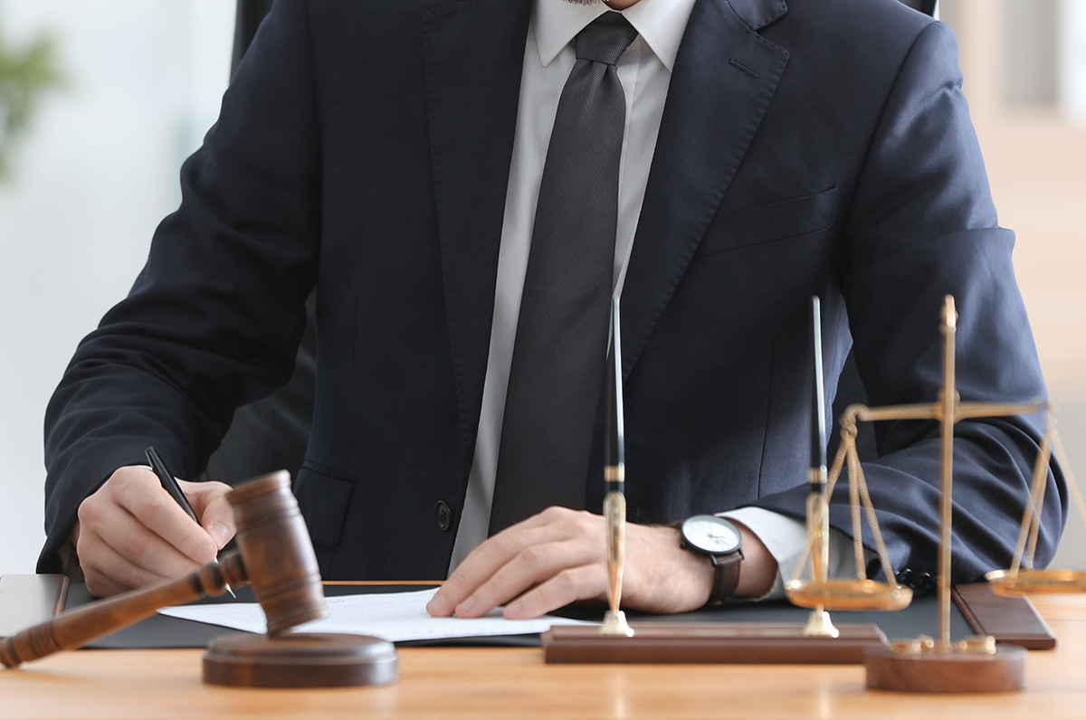Young male notary working in office