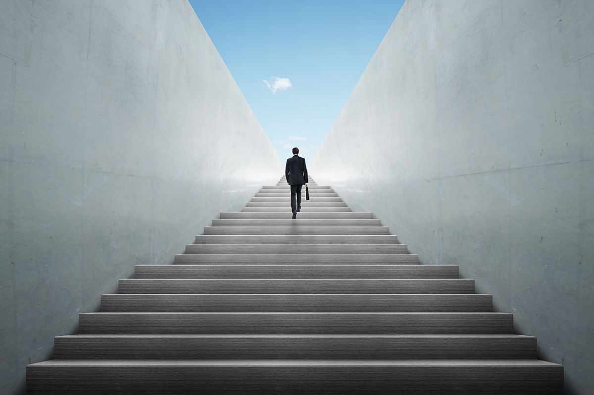 Man climbing up stair case