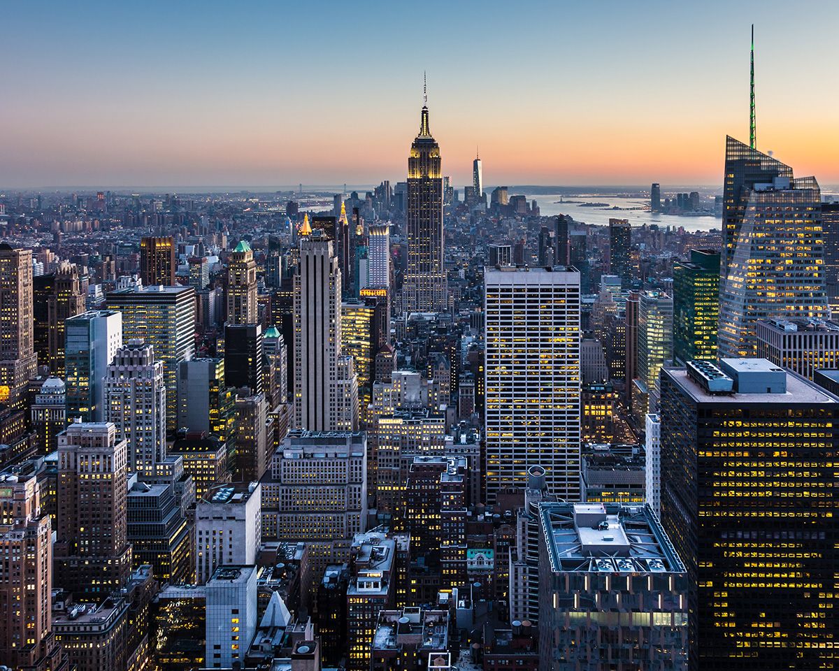 New York City skyline with urban skyscrapers at dusk, USA.